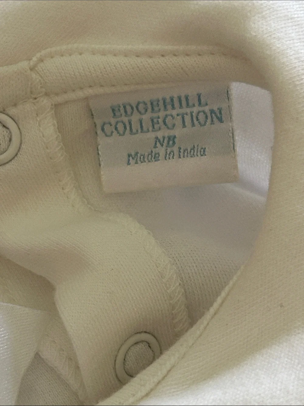 Edgehill Collection Ivory Footed Baby One-Piece with bow detail. NB